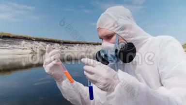 穿着防护服和呼吸器的人观察试管中水的化学反应